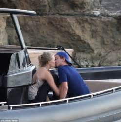 leonardo dicaprio sticks his tongue out at model toni garrn before they smooch in ibiza daily