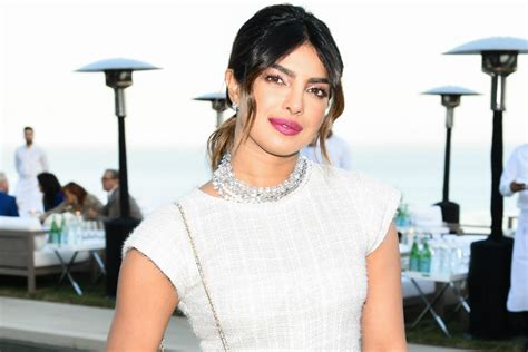 priyanka chopra flashes her abs in white hot crop top and matching loafers