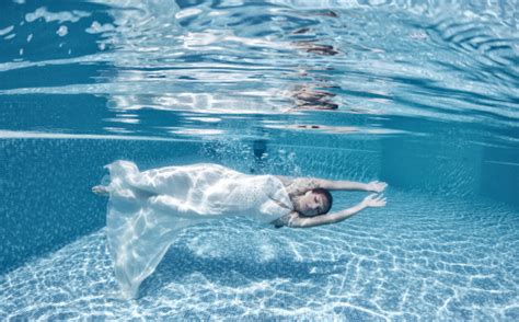 Beautiful Woman Girl Dress Underwater Diving Swim Blue Sunny Day Stock