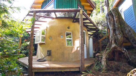 womans magical  house built earth  reclaimed materials