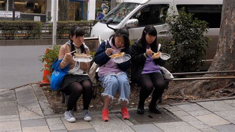 Three Japanese Girls Eating Junk Food On Stock Footage Sbv 323965364