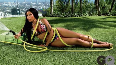 nicki minaj cools down with a hose pipe as she makes gq s year of
