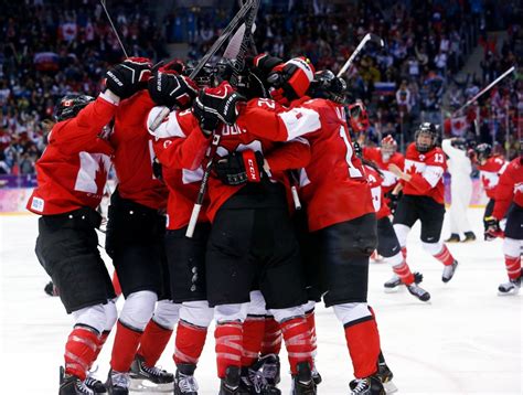 canada wins gold in women s hockey in sochi beating usa in overtime