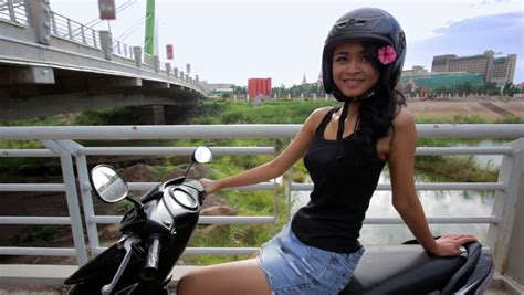 sexy asian girl with mini skirt sits on motorcycle stock footage video 2931985 shutterstock
