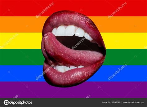 open female mouth with tongue against the rainbow flag background lgbt