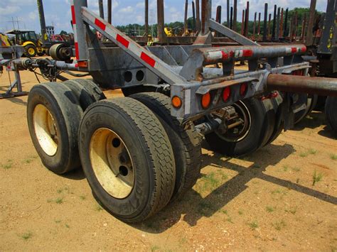 pole log trailer ta  bolster extendable  tires jm wood auction company