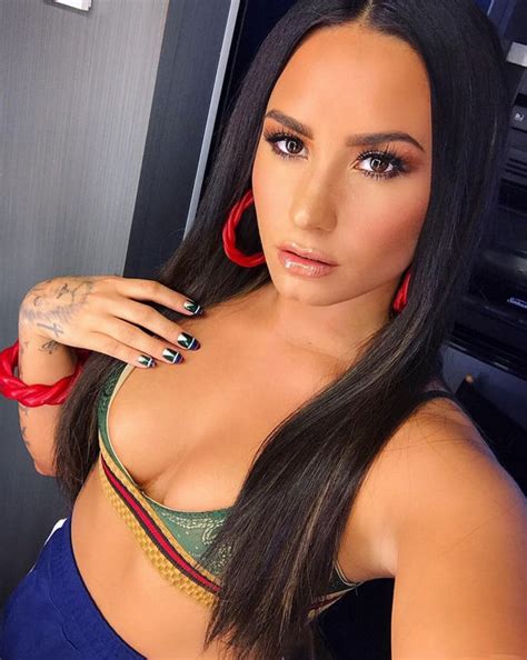 demi lovato flaunts extreme cleavage as she shows off sexy curves celebrity news showbiz