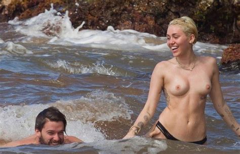 celebrity miley cyrus is topless at the beach
