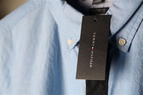Close Up Photo Of Blue Tommy Hilfiger Dress Shirt With Tag