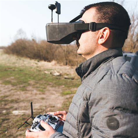 man manages fpv drone  vr glasses stock photo image  drone speed