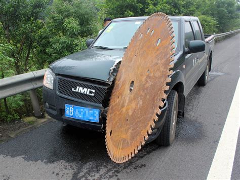 Driver Cheats Death On Chinese Motorway As Huge Saw Blade Cuts Into Car