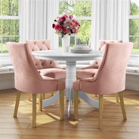 small  dining table  white   velvet chairs  pink rhode