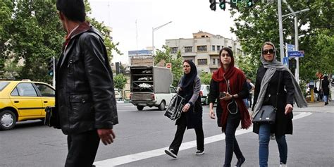 woman showing hair under headscarf assaulted by iran s morality police