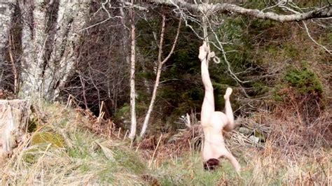 naked artist left hanging upside down from tree after bizarre film scene goes embarrassingly