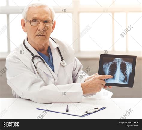 handsome  doctor image photo  trial bigstock