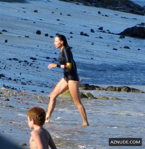 minnie driver swimming way out in the middle of the ocean