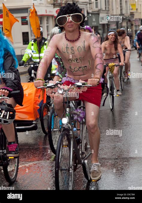 A Rally Of Naked Bike Riders Cycle Through Brighton On A Wet Saturday