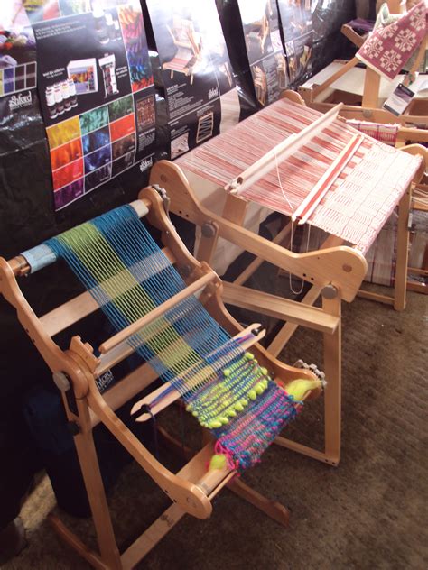 large weaving loomsthe larger loom        looms