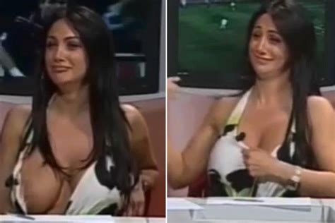 news anchor suffers huge wardrobe malfunction when boob slips out of low cut dress