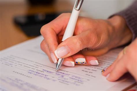 woman hand writing   form stock photo image  finger paper