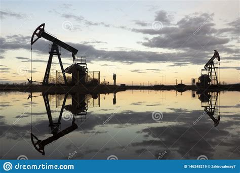 beam pumping unit  homework sunset  oil field oil pump oil rig energy industrial