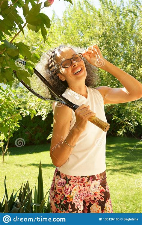 Laughing Woman Fifties Wearing Glasses Tennis Racket Stock
