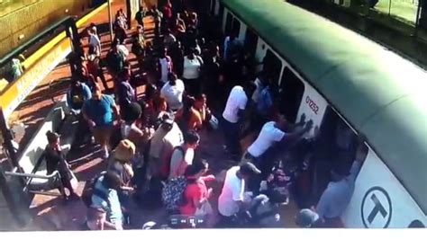 woman trapped by subway train begs bystanders not to call ems because