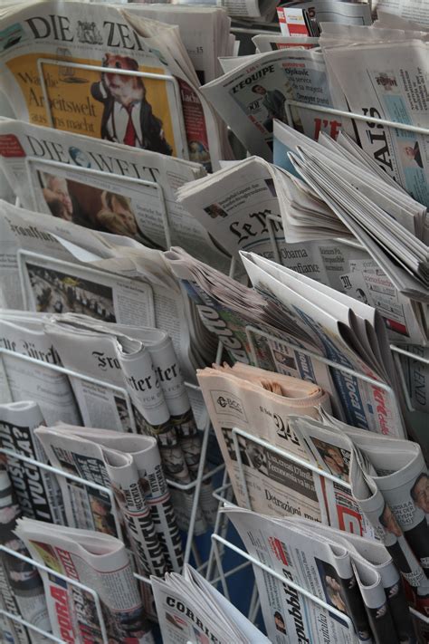 newspapers  stacked    shelf