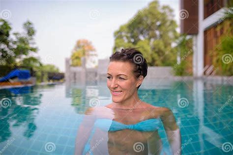 Mature Beautiful Scandinavian Tourist Woman In Swimming Pool Stock