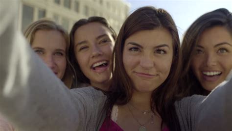 Closeup Of Carefree Teen Girls Making Funny Faces And