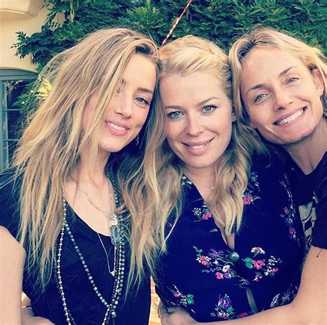 dragon amber heard is pictured smiling hours after depp s iphone attack