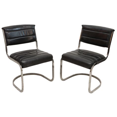 Set Of Four Ribbed Black Leather And Chrome Cantilever Dining Chairs At