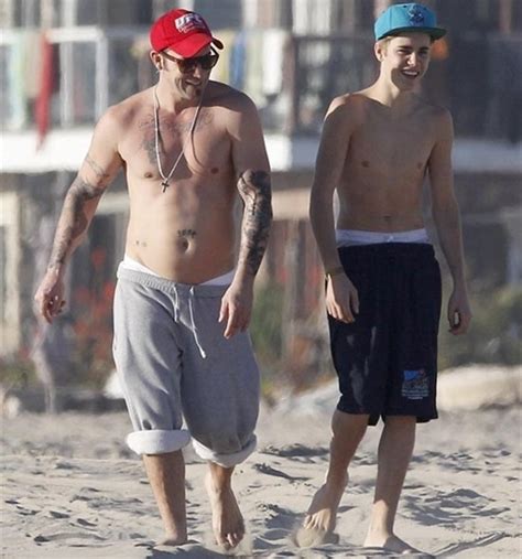 justin bieber and dad topless at the beach