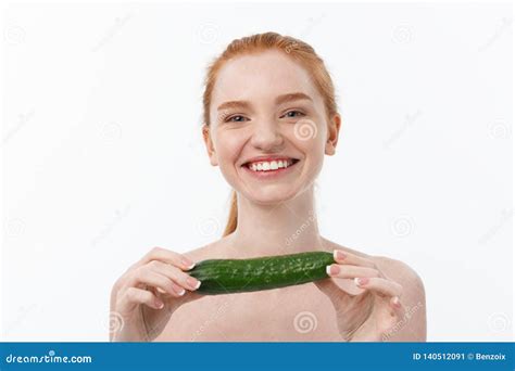 Cheerful Happy Beautiful Girl With Cucumber On Her Hand Isolated On