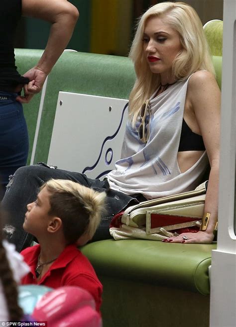 gwen stefani and gavin rossdale multitask as they have separate play