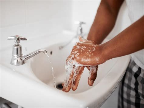 adults  cleaning  hands    toilet  coronavirus