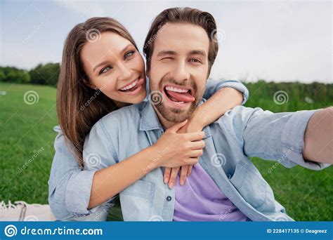 Photo Of Funky Funny Smiling Couple Take Selfie Fooling Around Show