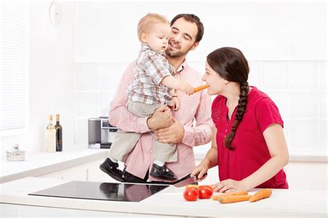 family preparing food   kitchen stock photo image  carrot