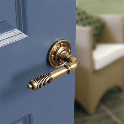 reeded lever handle  rose  aged brass handles