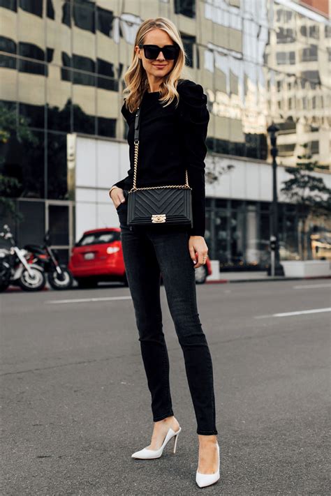 Blonde Woman Wearing Alice And Olivia Black Lidia Sweater
