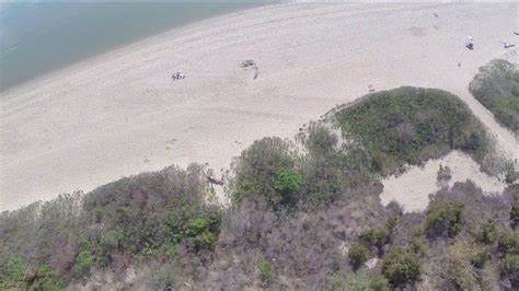 woman charged with assaulting teen who was operating drone at beach