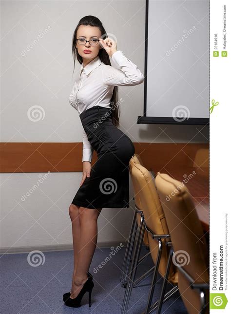 sexy business woman in office in glasses red lips stock
