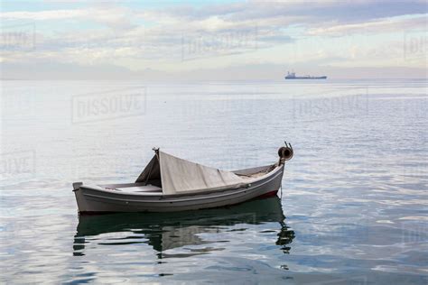 boat floating   tranquil aegean sea   ship   distance