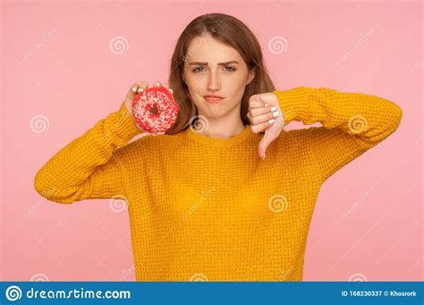 dislike  junk food portrait  displeased red hair girl  sweater