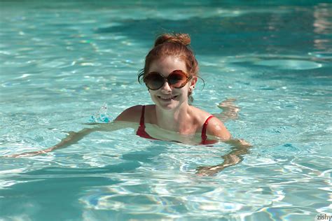 big tit redhead amateur essie halladay having fun in a swimming pool