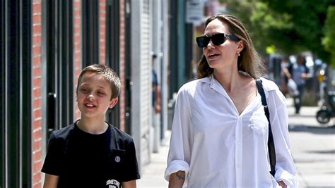 Angelina Jolie Wears White Shirt And Black Leggings Shopping
