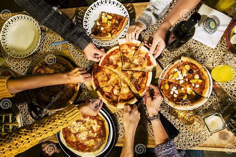 People Eat Pizza At Festive Table Served For Party Friends Celebrate