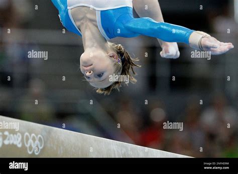 russia s gymnast ksenia semenova performs on the balance beam during
