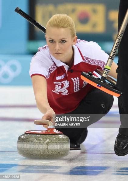 russia s alexandra saitova throws the stone during the