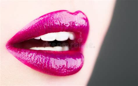 beautiful red lip lipstick and lipgloss lips tongue out portrait